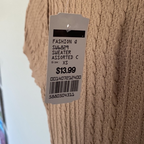 These tops are from fashion Q the black is a small and the tan is extra small. - Picture 7 of 8